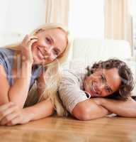 Close up of a cute couple lying on the floor