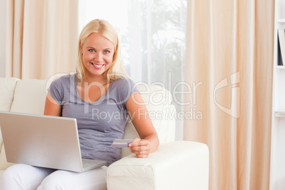 Blonde woman purchasing online