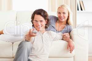 Lovely couple watching the television