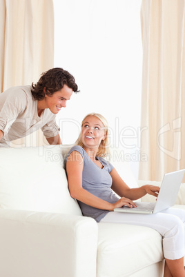 Portrait of a happy couple with a laptop