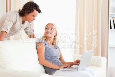 Happy couple with a laptop