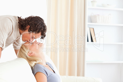 Man kissing his girlfriend on the forehead