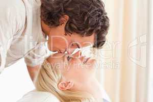 Close up of a man kissing his fiance on the forehead