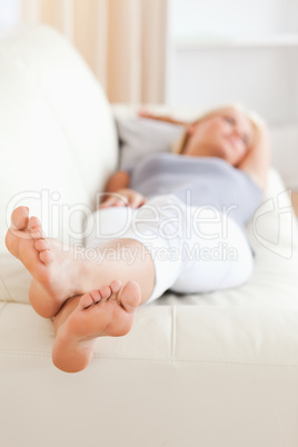 Woman lying on a sofa