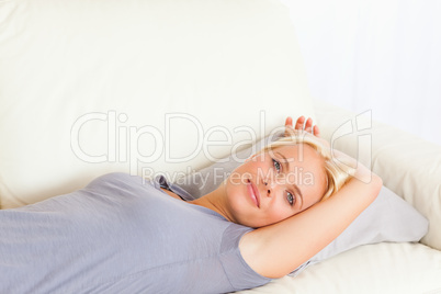 Close up of a woman lying on a sofa