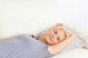 Close up of a woman lying on a sofa