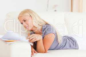 Blonde woman reading a magazine