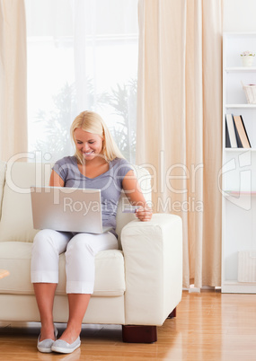 Portrait of a delighted woman shopping online