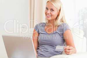Delighted woman buying online