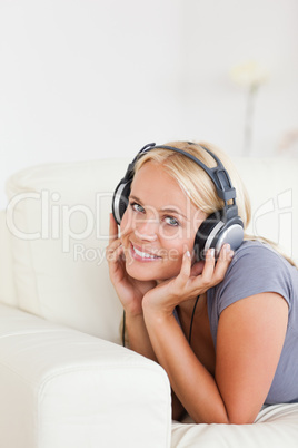Portrait of a blonde woman listening to music