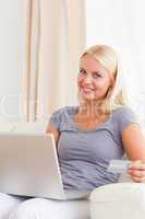 Portrait of a blonde woman shopping online