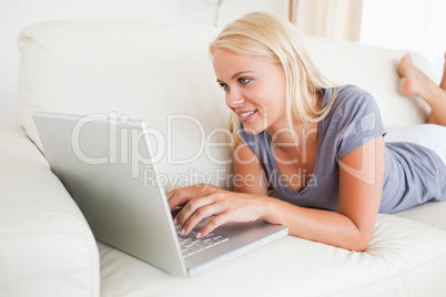 Lying woman using a laptop