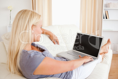 Woman switching on her laptop