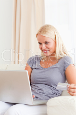 Portrait of a gorgeous blonde woman shopping online