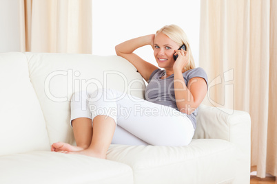 Smiling woman making a phone call