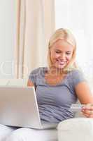 Portrait of beautiful smiling woman buying online