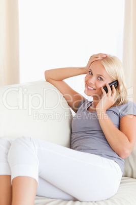 Portrait of a blonde woman making a phone call