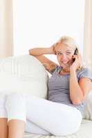 Portrait of a smiling woman making a phone call