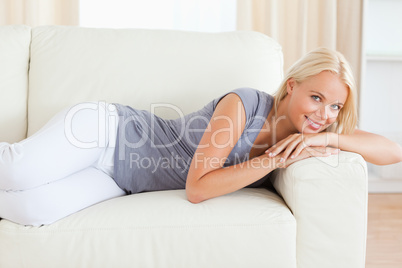 Serene woman resting on a sofa
