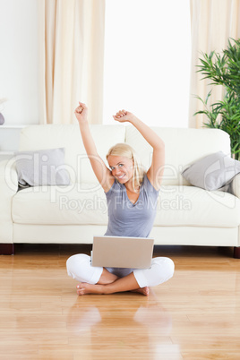 Portrait of a cheerful woman with a notebook while sitting on th