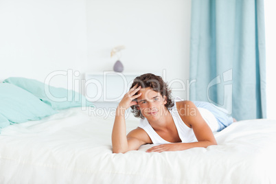 Man lying on his bed