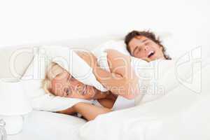 Angry woman awaken by her husband's snoring