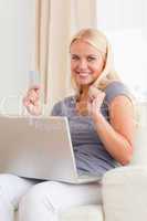 Portrait of a beautiful blond woman shopping online