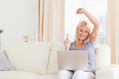 Smiling blonde woman shopping online