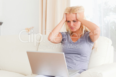 Unhappy woman with a laptop