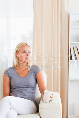 Portrait of a woman having a tea