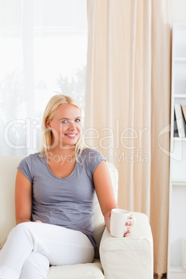 Portrait of a woman having a coffee