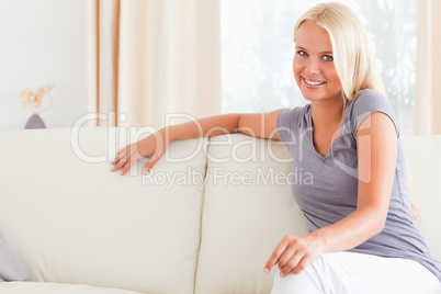 Gorgeous woman sitting on a sofa