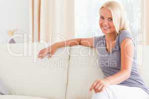 Gorgeous woman sitting on a sofa