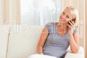 Smiling woman speaking on the phone
