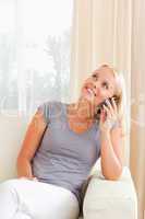 Portrait of a laughing woman speaking on the phone