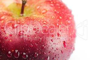 red apple with water drops isolated on white