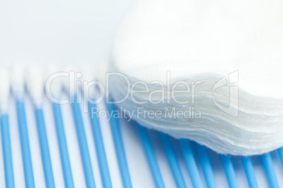 blue cleaning brush and cotton pads  isolated on white