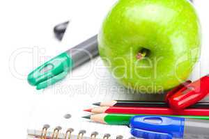 apple, notebooks and pencils isolated on white