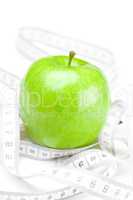 apple and measure tape  isolated on white