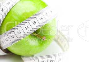 apple and measure tape isolated on white