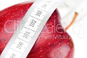 apple and measure tape isolated on white