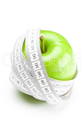 apple and measure tape isolated on white