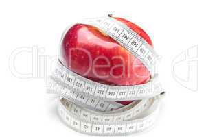 apple and measure tape isolated on white