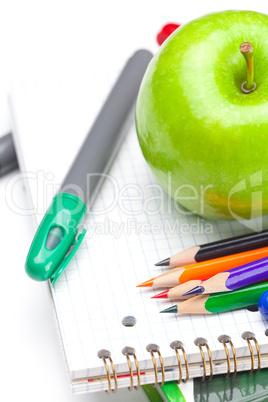 apple, notebooks and pencils isolated on white