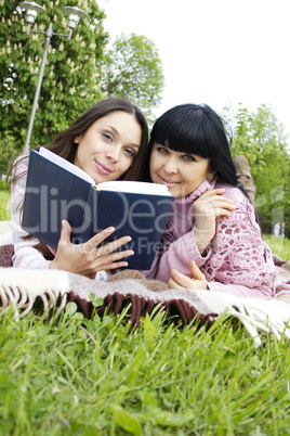 Mom and daughter reading a book