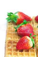 big juicy ripe strawberries and waffles isolated on white