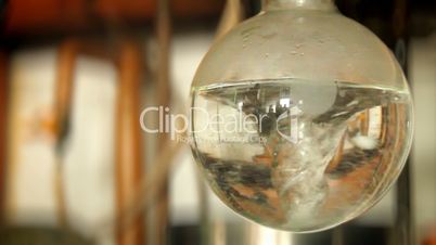 swirling water in a laboratory vessel