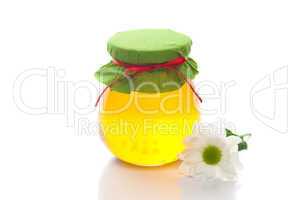 flower  and  jar of honey  isolated on white