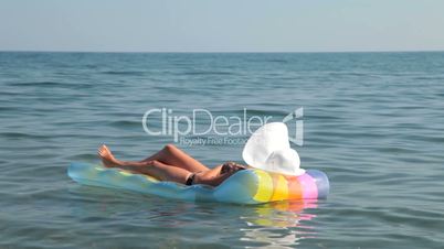 woman relaxing on raft