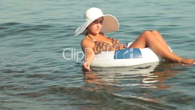 woman on raft enjoying